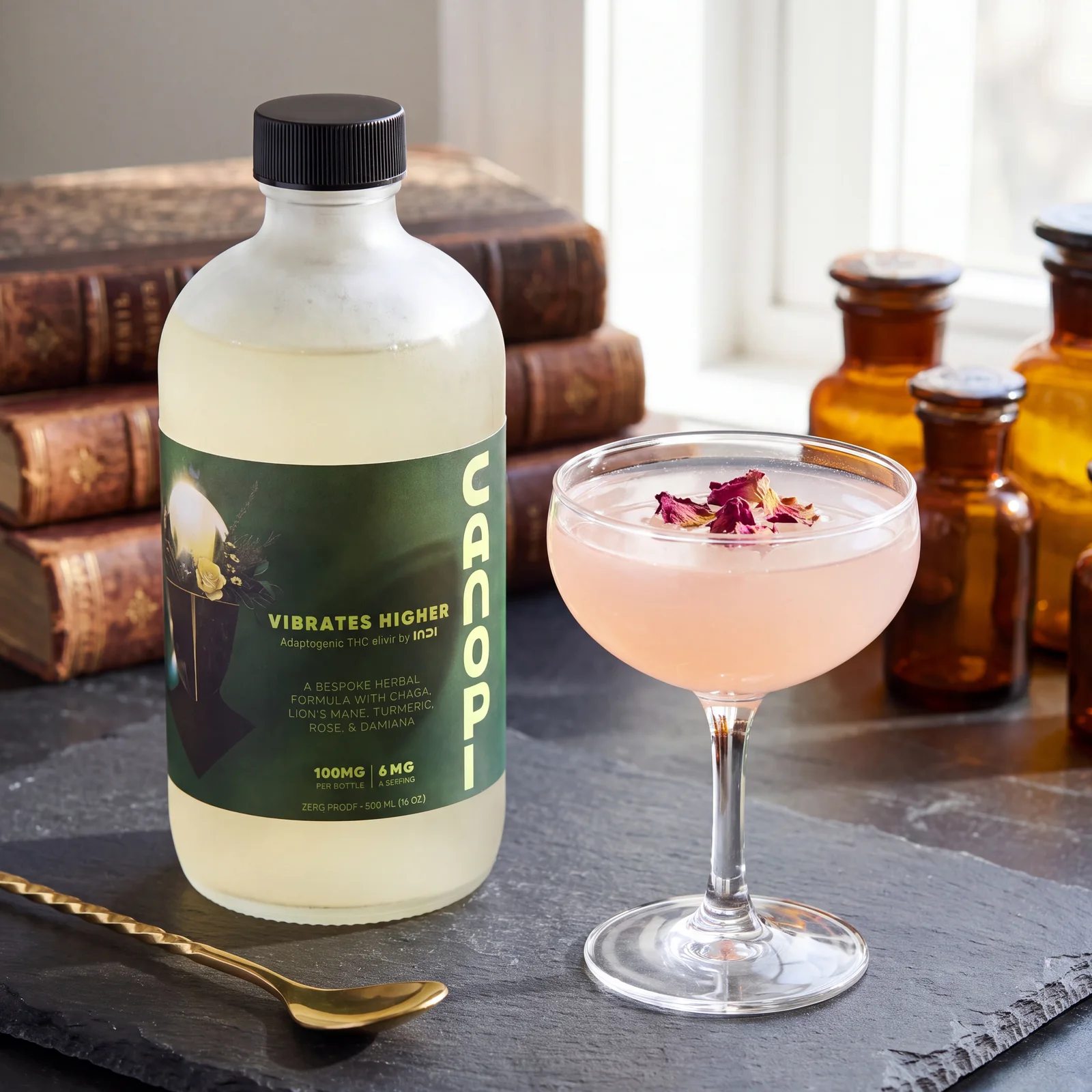Coupe glass mocktail with rose and turmeric tones beside a CANOPI bottle