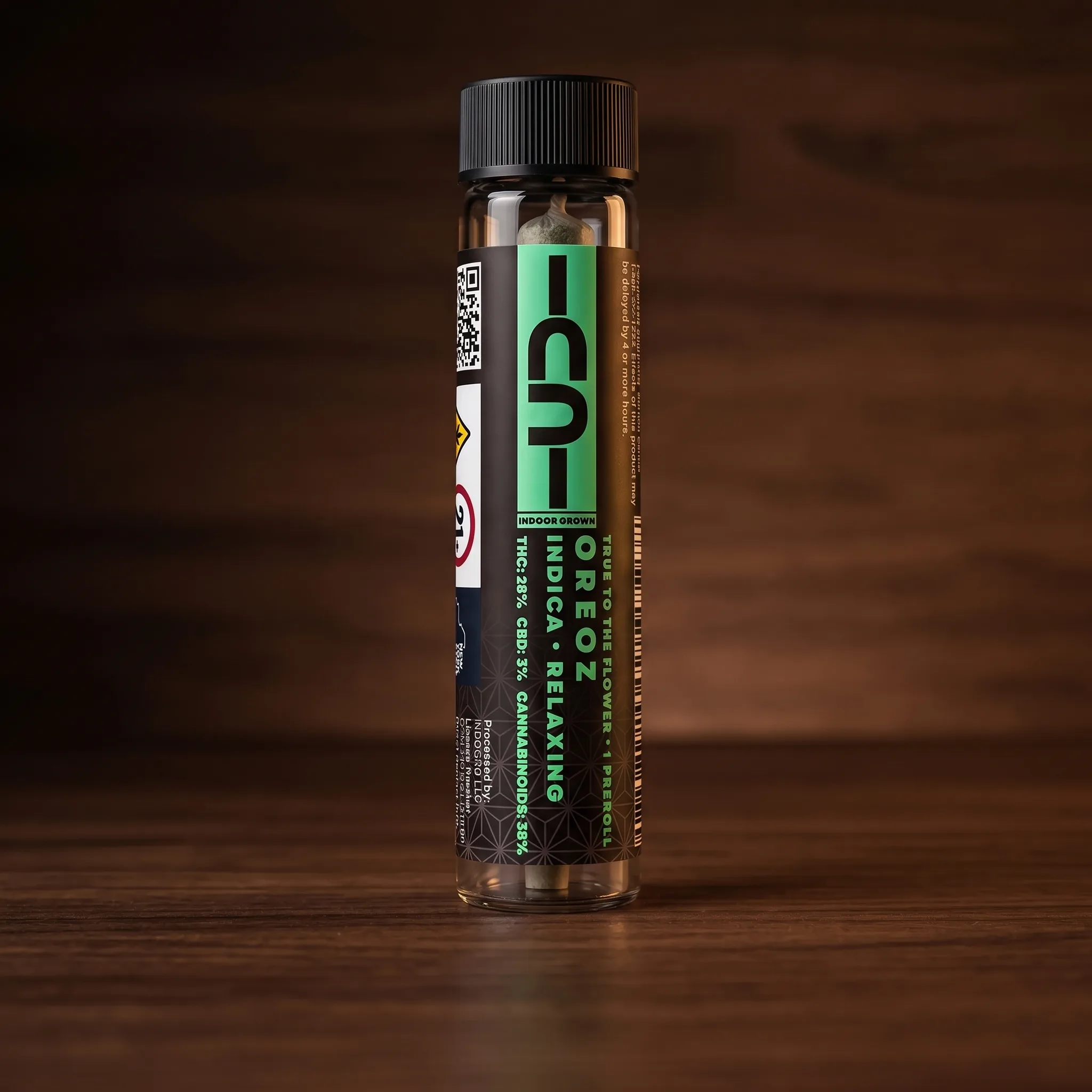 Oreoz indica pre-roll on dark walnut, black and mint CU label